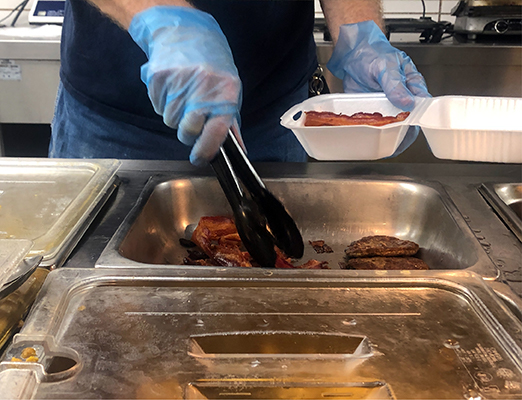 An employee serves food